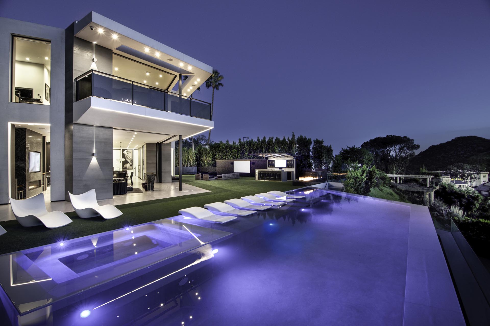 Infinity pool at dusk overlooking the city